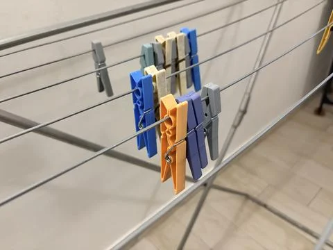 Colorful Clothespins on a Drying Rack 스톡 사진