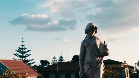 Colorful clouds and still statue Stock Footage