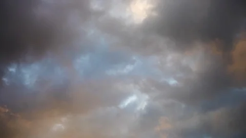 Colorful clouds float passed each other in a dramatic abstract sky Stock Footage 98587768
