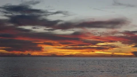Colorful clouds on the sea in the evening 스톡 동영상 142244890