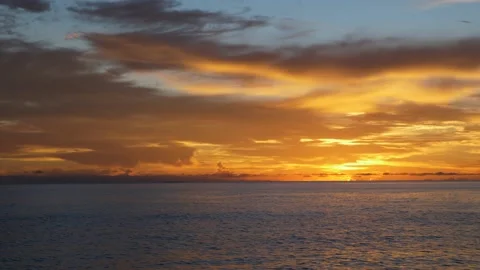 Colorful clouds on the sea in the evening Stock Footage 142244945