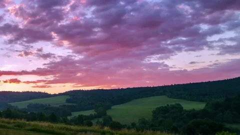 Colorful clouds sky over spring forest landscape nature at sunset Time lapse Stock Footage 153616116