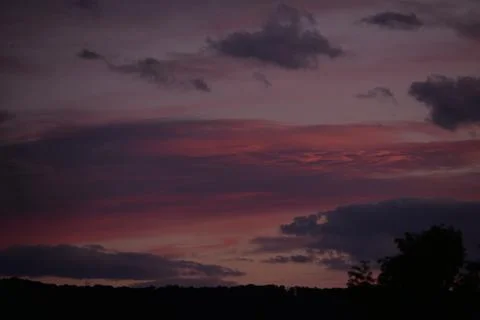 Colorful clouds in the sky at sunset Stock Photos