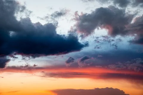 Colorful clouds in the sky at sunset Stock Photos