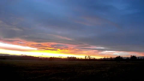 Colorful clouds at sunset in autumn timelapse video Video stock 136586190