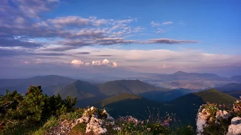 Colorful clouds at sunset over summer mountain landscape. 4K Video stock 169971433