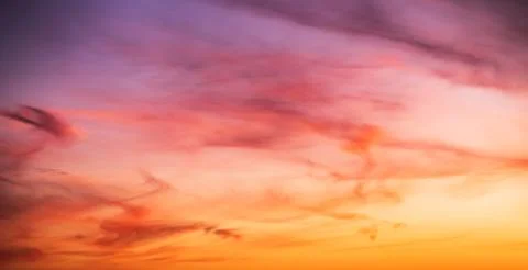 Colorful cloudy sky at sunset. Gradient pink, orange, blue colors. Beautiful  Stock Photos