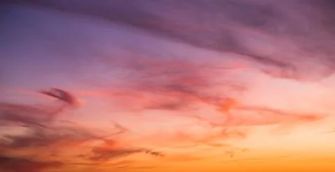 Colorful cloudy sky at sunset. Gradient pink, orange, blue colors. Beautiful  Stock Photos