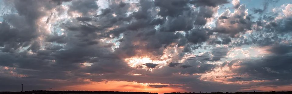 Colorful cloudy sky at sunset. Gradient color. Sky texture, abstract nature b Stock Photos