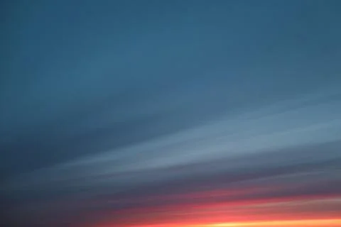 Colorful cloudy sky at sunset. Gradient color. Sky texture. Beautiful abstrac Stock Photos