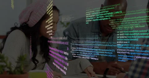 Colorful code drifting down revealing three software developers marking up Stock Footage 309895424