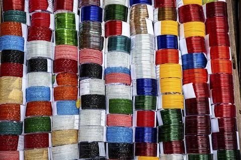 Colorful Coiled Bangle Bracelets Display in Bright Array Stock Photos