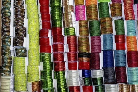 Colorful Coiled Bangle Bracelets Display in Bright Array Stock Photos