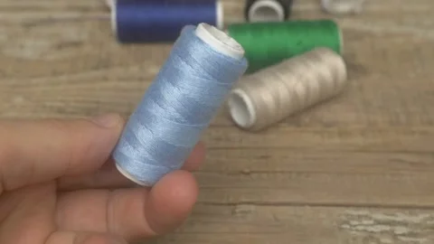 A colorful collection of sewing threads ideal for crafting and tailoring Видео 287454477
