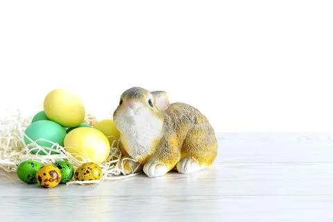 Colorful colored Easter chicken eggs with rabbit bunny toy, spring, Easter co Stock Photos