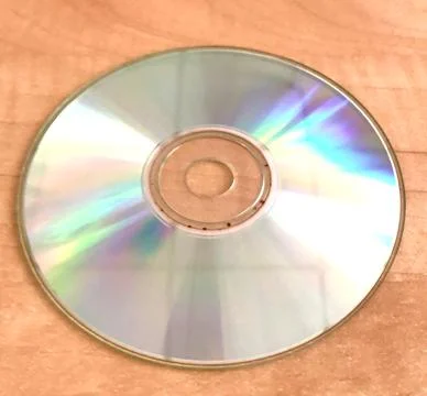 Colorful compact disc on a table Stock Photos
