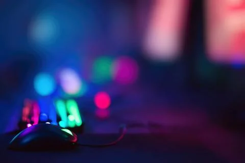 Colorful computer room with selective focus on computer mouse Stock Photos