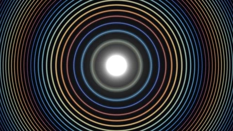 Colorful concentric circles form patterns around a bright Stock Footage 338438072