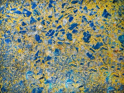 Colorful Concrete Surface with Embedded Blue Stones Stock Photos
