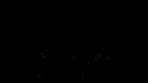 Colorful confetti bursts exploding against a deep black background for festive Vídeo Stock 344712426