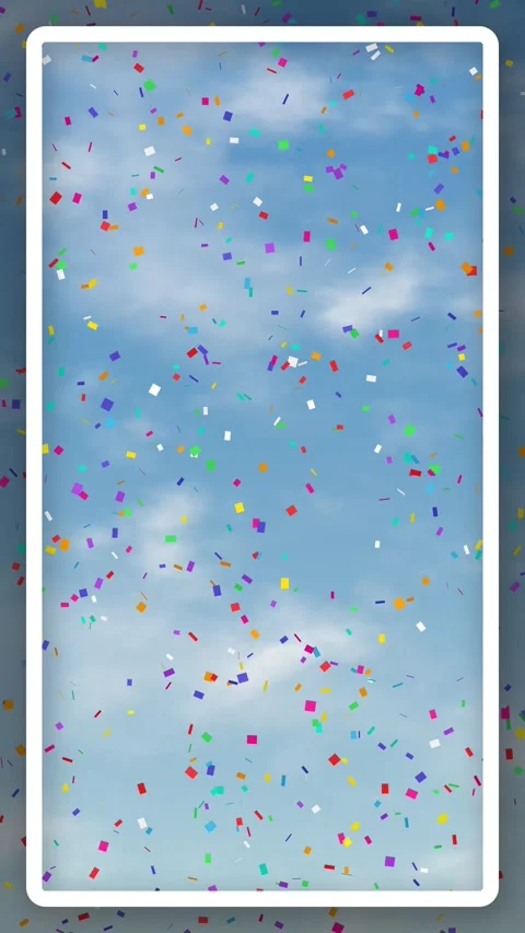 Colorful Confetti Falling Against a Cloudy Blue Sky Background Stock Footage 342208525