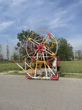 A colorful cradle on the road. Stock Photos