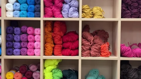 Colorful Craft Strings Displayed on Shelves in a Haberdashery Stock Footage 279249059