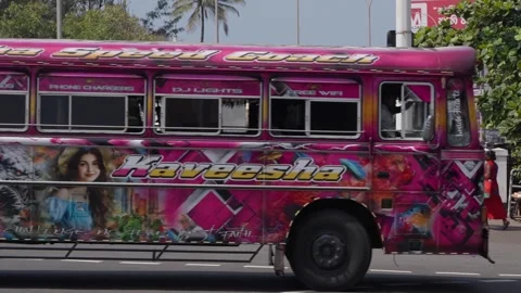 Colorful crazy buses on a busy street in Galle, editorial video Stockbeeldmateriaal 331644341