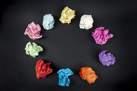 Colorful Crumpled Papers Circular Pattern on black background  copy space w.. Stock Photos
