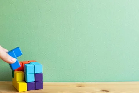 Colorful cube puzzle blocks. Problem solving, creative idea concept Stock Photos