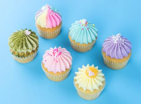 Colorful Cupcake for festival celebrate tion top view on blue background Stock Photos