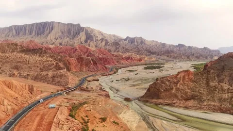 Colorful Danxia Landform with Winding River and Road Xinjiang China Stock Footage 346570094