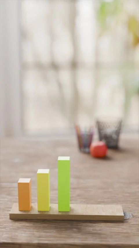 Colorful data growth trend chart on wooden base Stock Footage 312469840