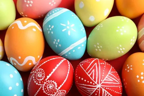 Colorful decorated Easter eggs as background, top view Stock Photos