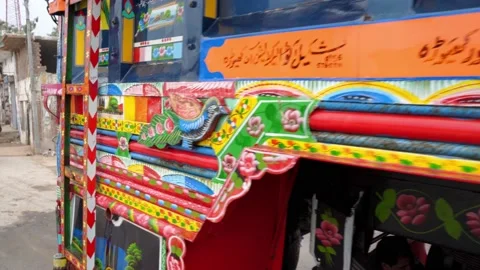 Colorful decorations displayed on a side wall of traditional Jingle Truck Stock Footage 132928008