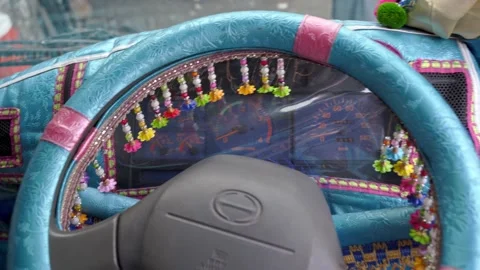 Colorful decorations inside of driver cabin of Pakistani Jingle Truck Stock Footage 132927621