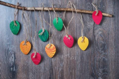 Colorful decorative Easter eggs made of paper on a wooden background. Top v.. Stock Photos