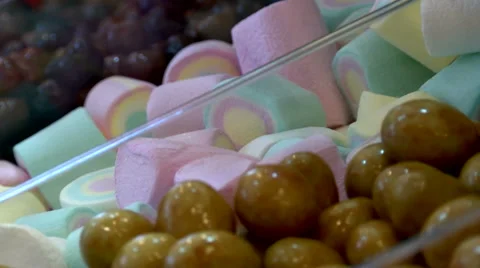 Colorful delicious candy in plastic boxes, close-up and then a zoom out Stock Footage 55852224