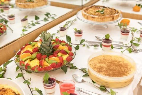 Colorful dessert table with assorted fruit platter Stock Photos