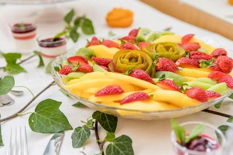 Colorful dessert table with assorted fruit platter Stock Photos