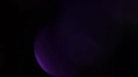 Colorful diffused light swirls in the background. Video stock 309963211