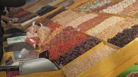 Colorful display of nuts and dried fruits at eco-friendly market in Central Asia Stock Footage 321827136