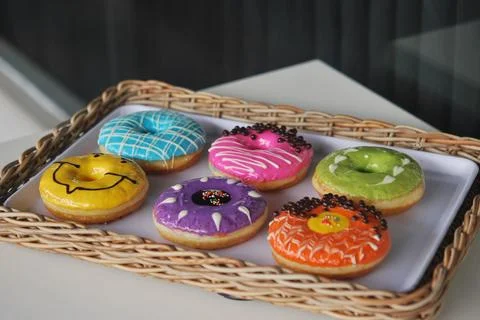 Colorful donuts on a serving table Foto stock