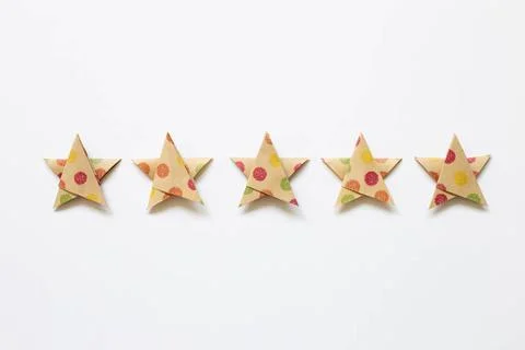 Colorful dot pattern brown five stars quality rating on white background. ... Stock Photos