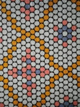 Colorful dots forming geometric pattern on soft fabric Stock-Fotos
