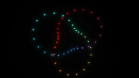 Colorful dots of light move and create various shapes in a Stock Footage 338288726