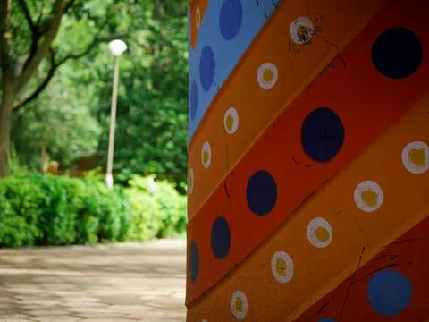 Colorful dotted side frame image at blur garden background. Stock Photos