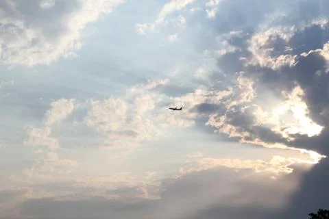 Colorful Dramatic Clouds With Plane Stock Photos