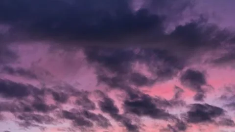 Colorful dramatic clouds at sunset Stock Photos