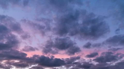Colorful dramatic clouds at sunset Stock Photos